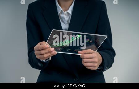 Business growth concept with professional analyzing rising financial graph on digital interface. Revenue increase, profit growth, performance improvem Stock Photo