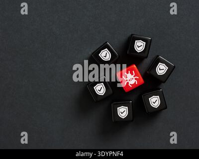 Red digital virus icon surrounded by black shield icons, representing a cybersecurity threat detected and blocked by the network defense Stock Photo