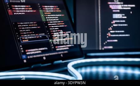 Futuristic AI Programming Workspace with 2026 Numbers and Source Code on Screen in Blue Neon Stock Photo