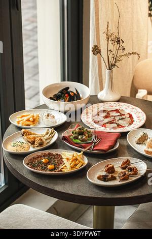 Assorted restaurant appetizers on table Stock Photo