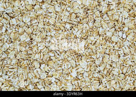 Many delicious flakes oat on grocery market counter, tasty organic food consisting of fresh raw flakes oat close up, beautiful texture ripe of natural Stock Photo