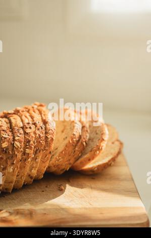Sliced sourdough loaf on wooden board with copy space Stock Photo