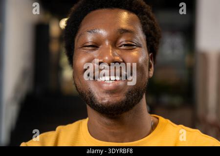 Young male close up portrait with friendly smile Stock Photo