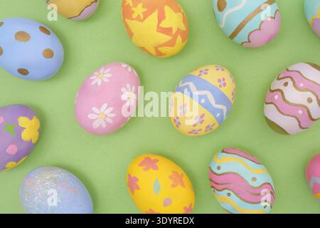 Easter Eggs. Beautifully painted eggs arranged on green background. Stock Photo