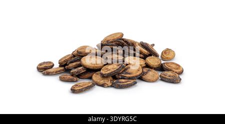 Dried watermelon seeds forming a small pile on a solid white surface Stock Photo