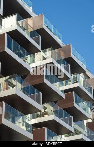 View of modern architectural design featuring stacked balconies with glass railings against the clear blue sky, Oslo, Oslo, Norway. Stock Photo