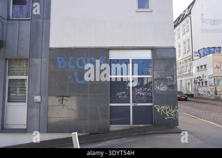 Word game of building block and block someone, block U, block you, block someone, lettering on wall, graffiti-decorated concrete facade of a modern b Stock Photo