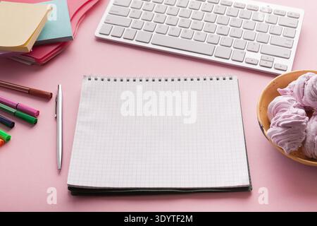 Spiral notepad on pink background Stock Photo