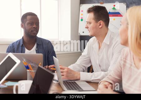 Business meeting. Multiethnic team in office Stock Photo