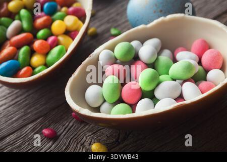 Chocolate eggs filled with colorful candies Stock Photo
