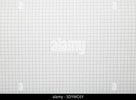 Macro shot of a black metal double-wire spiral binding on white notebook. Top view Stock Photo