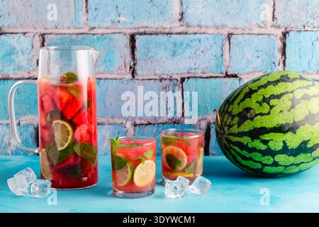Fresh tasty delicious watermelon lemonade on a blue background, selective focus Stock Photo
