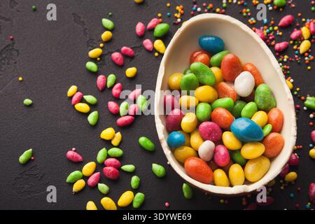Chocolate egg and colorful candies Stock Photo