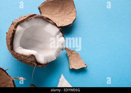 Closeup healthful coconuts on a light blue background Stock Photo