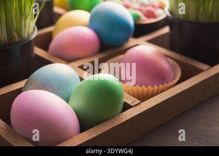 Easter eggs in wooden container Stock Photo