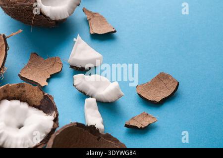 Closeup healthful coconuts on a light blue background Stock Photo