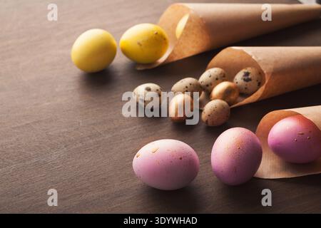 Easter composition with eggs in craft paper cornets Stock Photo
