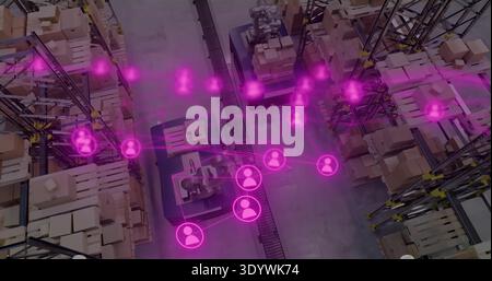 Operating central conveyor and robotic palletizers in warehouse, showing magenta network overlay Stock Photo