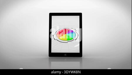 Showing black tablet bezel home-button centered on desk in studio featuring pie chart HUD rings Stock Photo