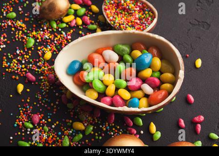 Chocolate egg and colorful candies Stock Photo