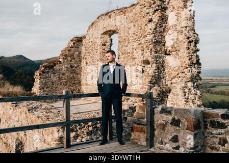 Full length shot of young groom in suit. Stock Photo