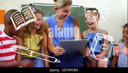 Holding tablet, teacher in sleeveless blue top engaging five kids in class with chalkboard graphics Stock Photo