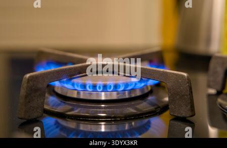 Blue natural gas flame burning on Dutch kitchen stove, energy consumption concept. Gasverbruik, eneregiecrisis Stock Photo
