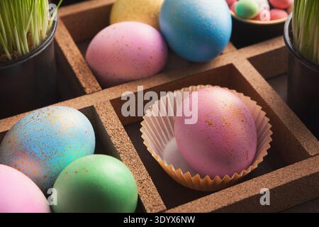 Easter eggs in wooden container Stock Photo