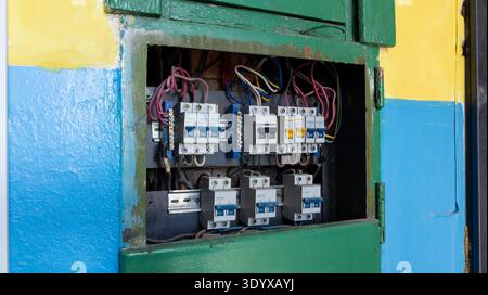 Electrical distribution board with fuses or circuit breakers in an old apartment building. Electrical equipment. Distribution board with fuses. Stock Photo