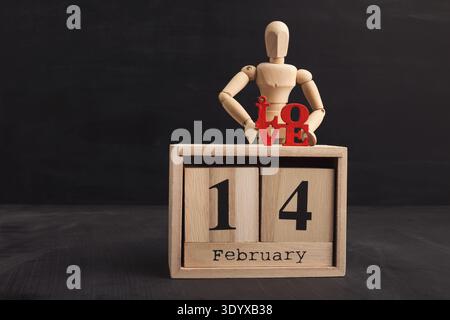 Wooden mannequin with red word love Stock Photo