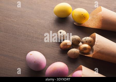 Easter composition with eggs in paper cornets Stock Photo