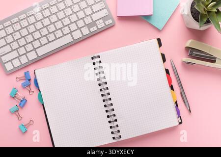 Spiral notepad on pink background, top view Stock Photo