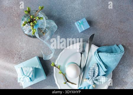Spring Celebration Setting with Soft Blue Decor.. Stock Photo