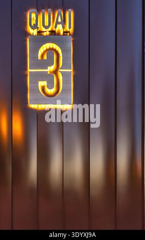 A brown aluminum profile wall shows its metallic surface and vertical lines. This industrial texture remains a clean background for design projects. Stock Photo