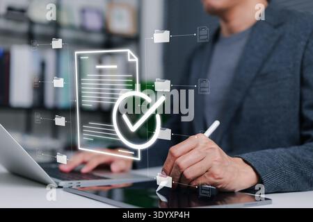 Digital document management system concept with businessman using tablet and stylus to approve files. Efficient electronic paperwork processing Stock Photo