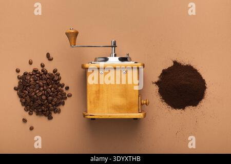 Retro coffee grinder, beans and powder on old table, top view Stock Photo