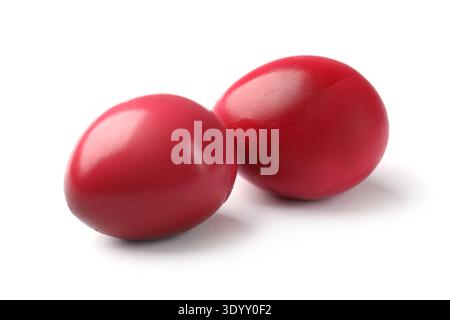 Two pickled quail eggs isolated on white Stock Photo