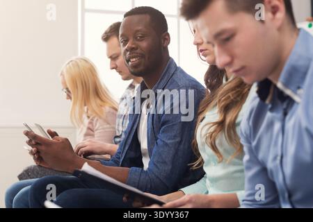 Group of business people using gadgets Stock Photo