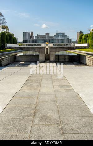 Cenotaph and Flame of Peace Aligned Toward Hiroshima Peace Memorial Museum, Hiroshima, Japan. Stock Photo