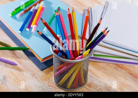 Colored pencils kept in pencil holder Stock Photo