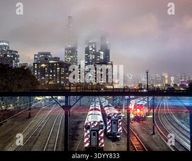 Train tracks at 18th street in downtown Chicago, Illinois, USA during a stormy, cloudy night Stock Photo