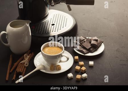 Coffee cup and sweets on black table Stock Photo