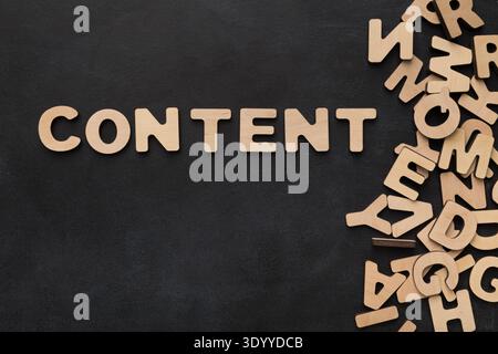 Content made with wooden letters on black background Stock Photo
