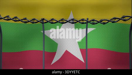 Framing white star behind chainlink mesh at fence line, with tricolor flag, razor wire, posts Stock Photo