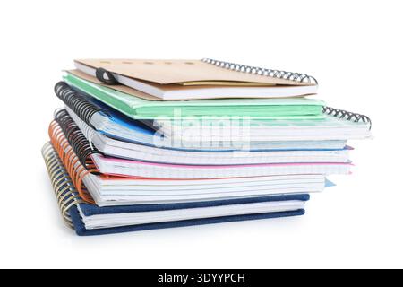 Stack of many different notebooks isolated on white background Stock Photo