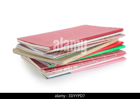 Stack of many different notebooks isolated on white background Stock Photo