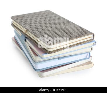Stack of many different notebooks isolated on white background Stock Photo