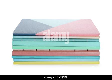 Stack of many different notebooks isolated on white background Stock Photo