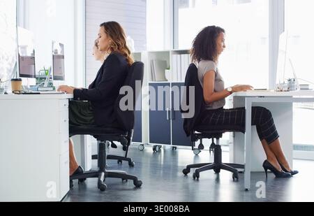 Women, business and coworking with colleagues in agency for company finance or administration. Female people, employees or team working together in Stock Photo