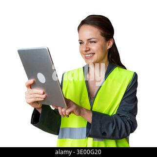 Professional female inspector in safety vest working on digital tablet. Stock Photo